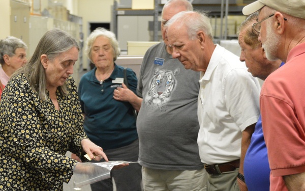Museum volunteers visit artifact storage facility