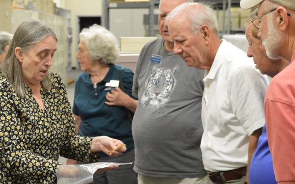 Museum volunteers visit artifact storage facility