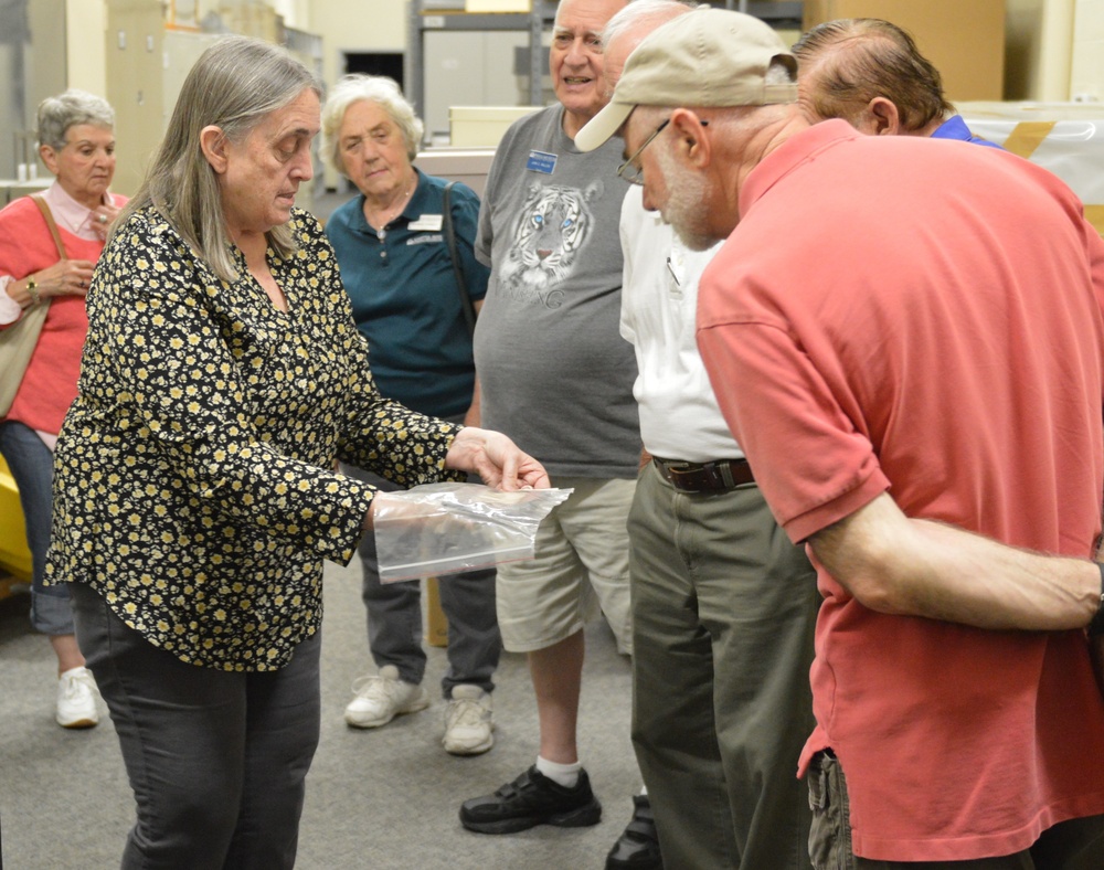 Museum volunteers visit artifact storage facility