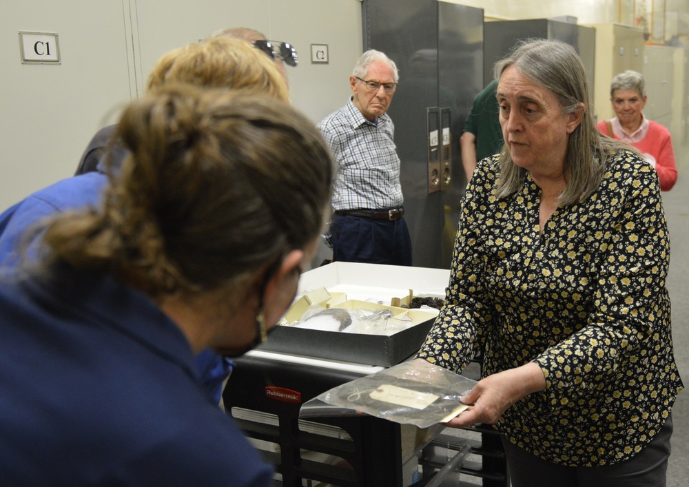 Museum volunteers visit artifact storage facility