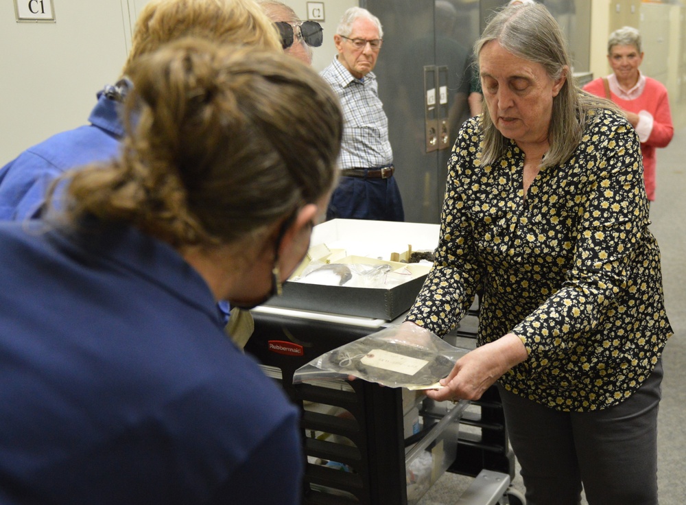 Museum volunteers visit artifact storage facility