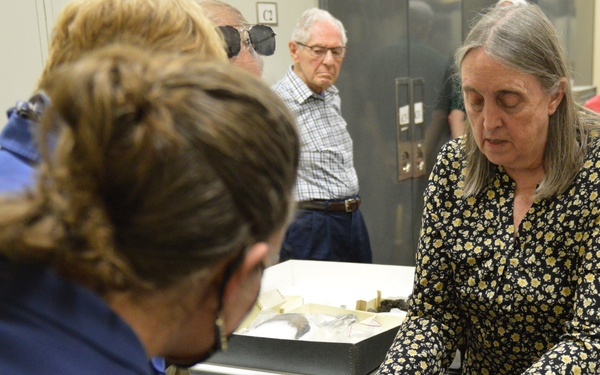 Museum volunteers visit artifact storage facility