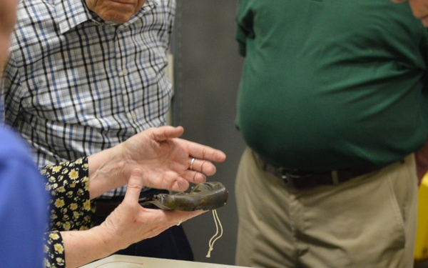 Museum volunteers visit artifact storage facility