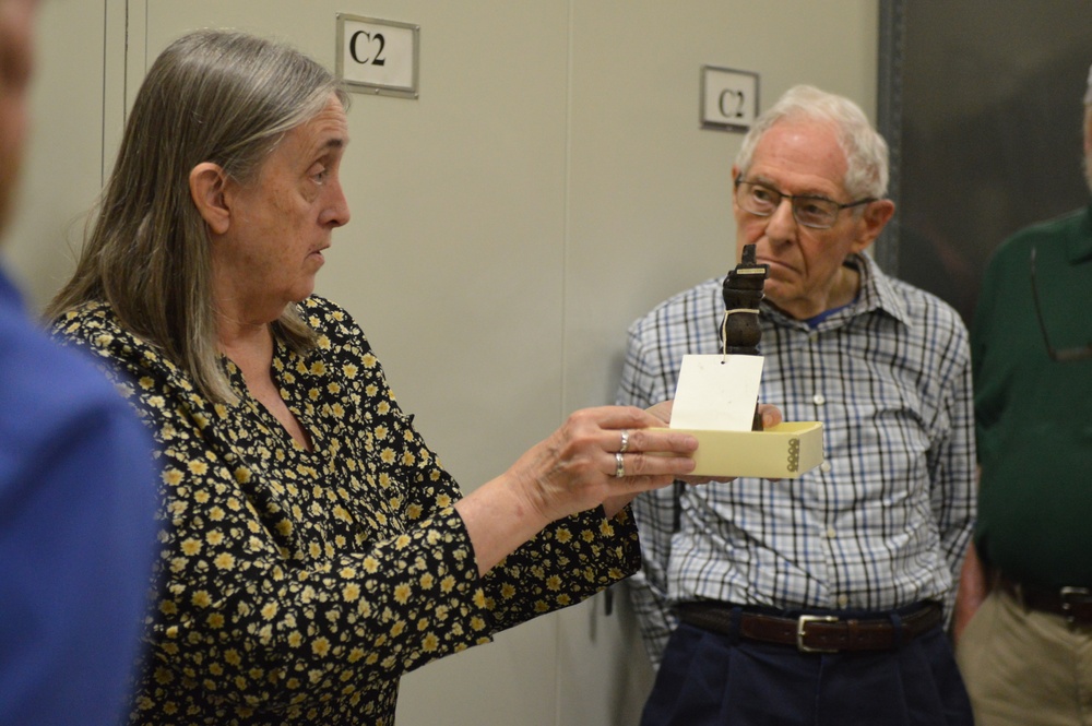 Museum volunteers visit artifact storage facility