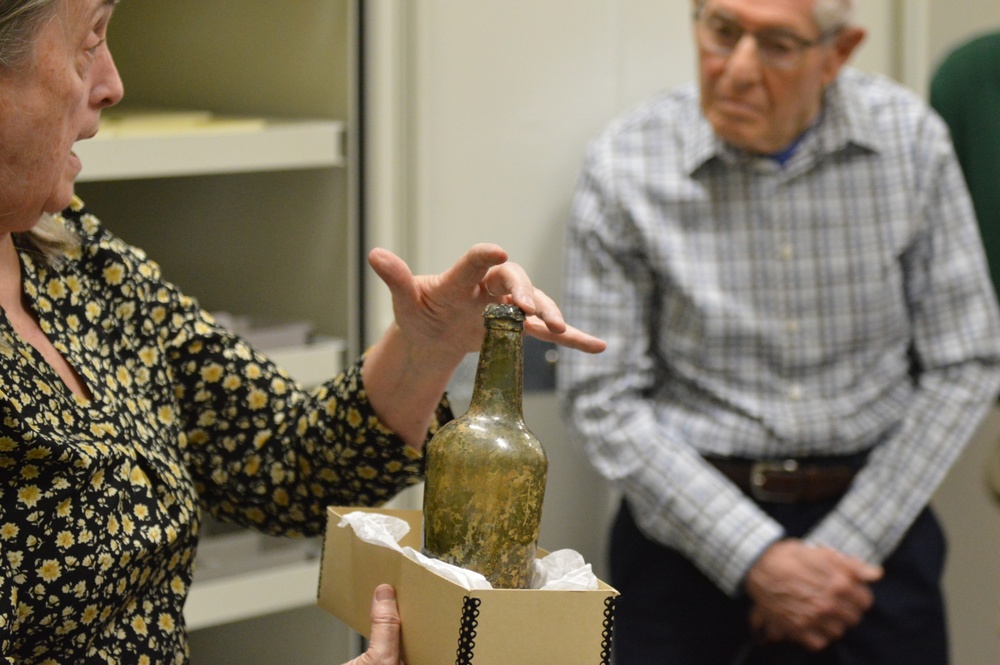 Museum volunteers visit artifact storage facility