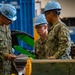 Sailors review inventory in the hangar bay