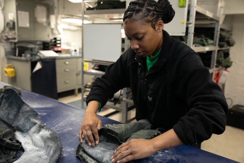 USS George H.W. Bush Sailor Maintains Equipment