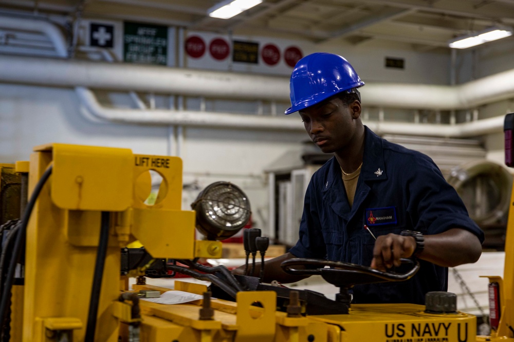 USS George H.W. Bush (CVN 77) Sailor Conducts Maintenance