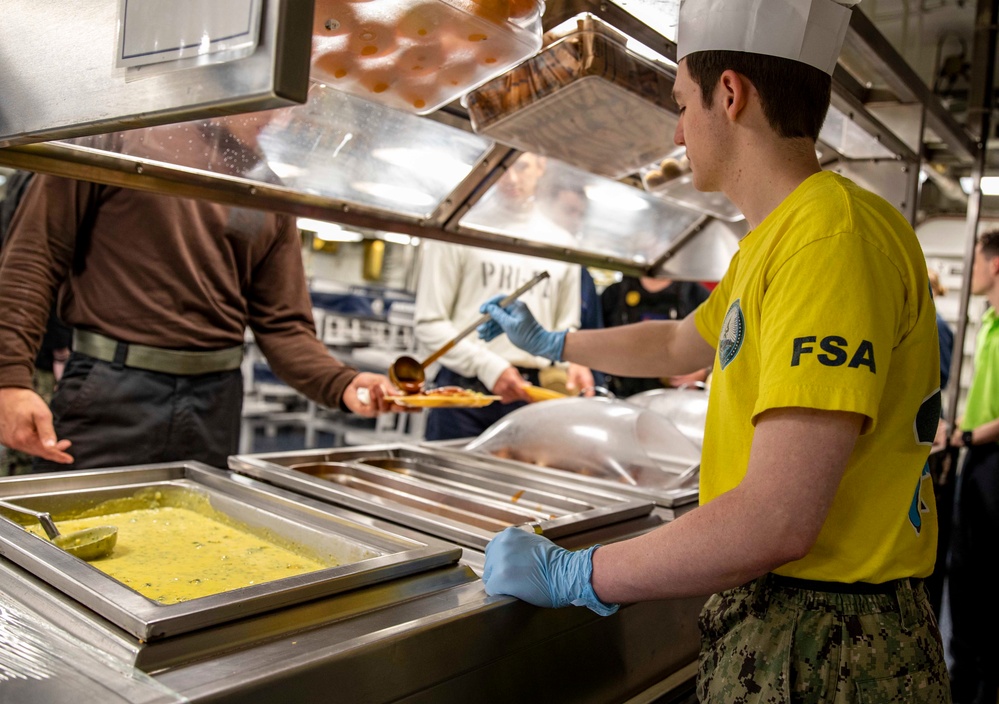 USS George H.W. Bush Sailor Serves Food