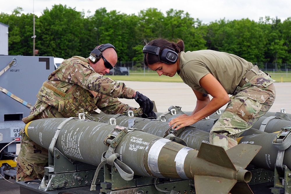 Airman securing bombs during Agile Combat Employment (ACE) training