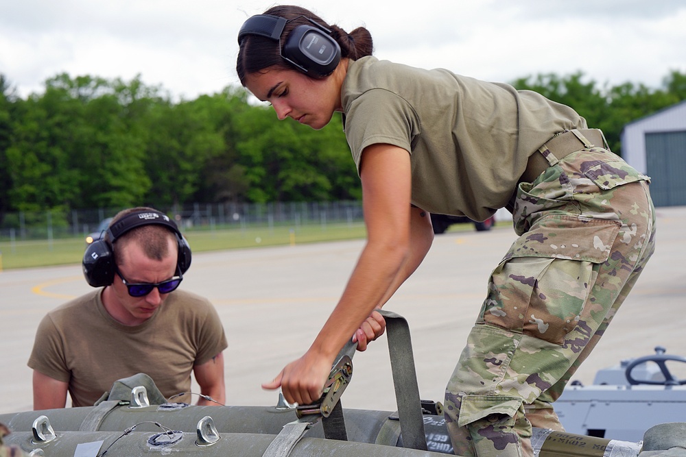 Airman securing bombs during Agile Combat Employment (ACE) training