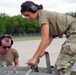 Airman securing bombs during Agile Combat Employment (ACE) training