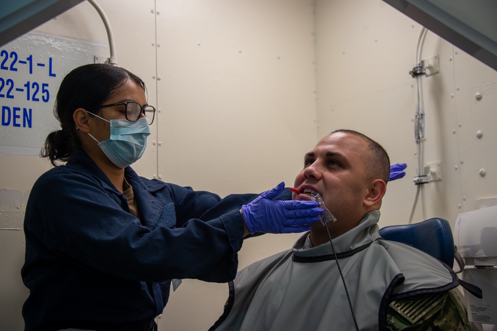 USS Carl Vinson (CVN 70) Sailors Work in Port