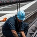 USS Carl Vinson (CVN 70) Sailor Performs Maintenance