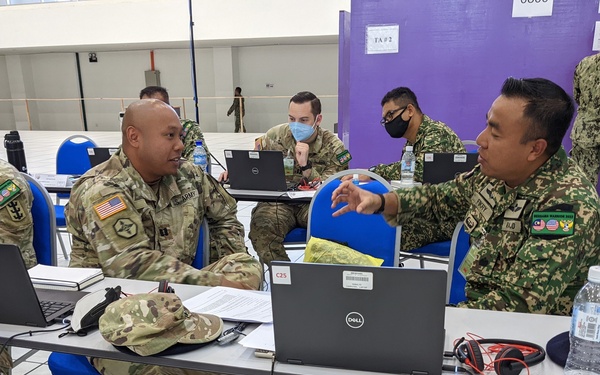 U.S. and Malaysian service members work together