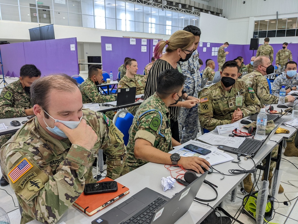 U.S. and Malaysian service members work together