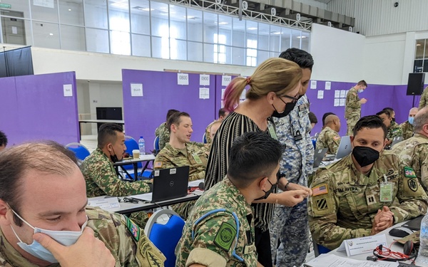 U.S. and Malaysian service members work together