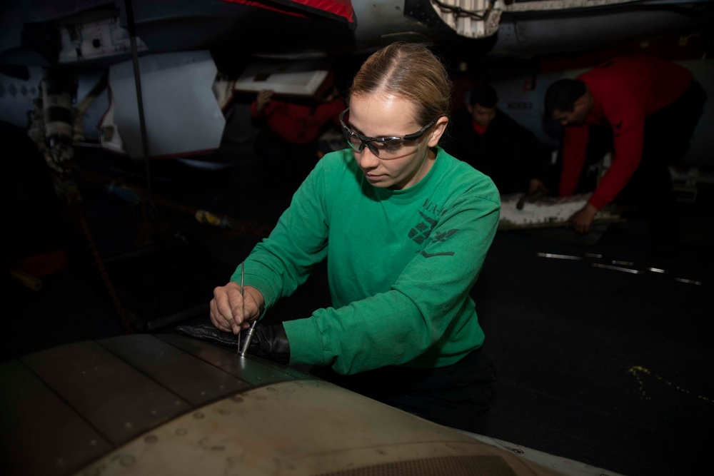 Sailor Files Down Rivet On Jet Engine Door