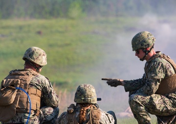 Seabees observe range commands as they qualify on the M2A1