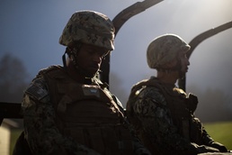Seabees are transported to the range before sunlight