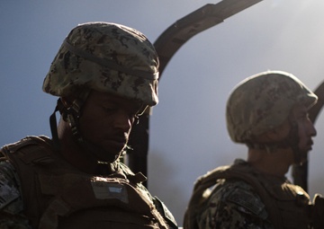 Seabees are transported to the range before sunlight