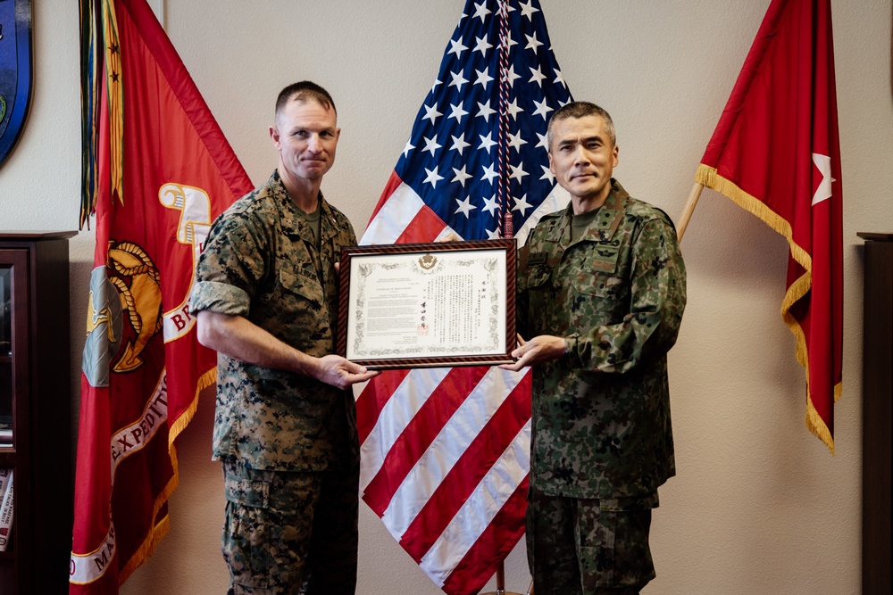 BGen Ellison is awarded by MGen Shingo Nashinoki