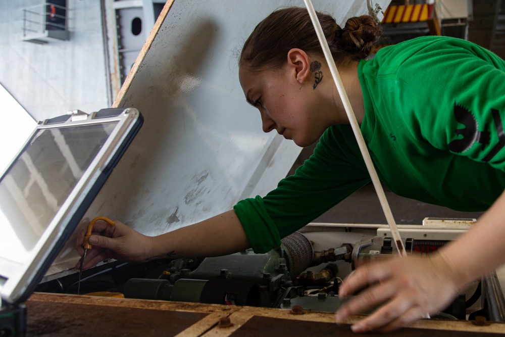 Abraham Lincoln Sailor conducts maintenance