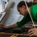 Abraham Lincoln Sailor conducts maintenance