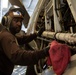 Abraham Lincoln Sailor conducts aircraft maintenance