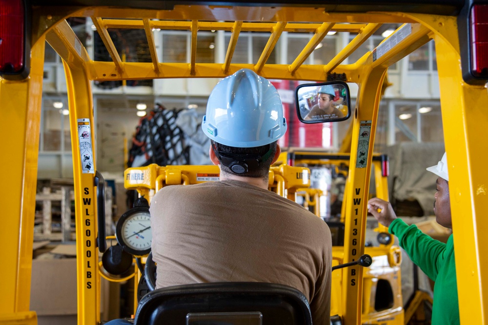 Abraham Lincoln Sailors remove HAZMAT