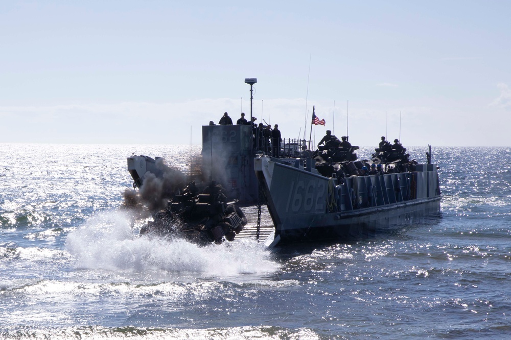 Landing Craft Utility boat offloads Marines onto the shore of Gotland Island