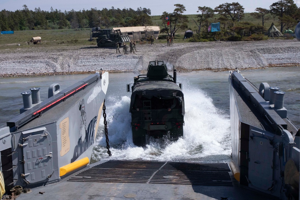 Landing Craft Utility boat offloads Marines onto the shore of Gotland Island