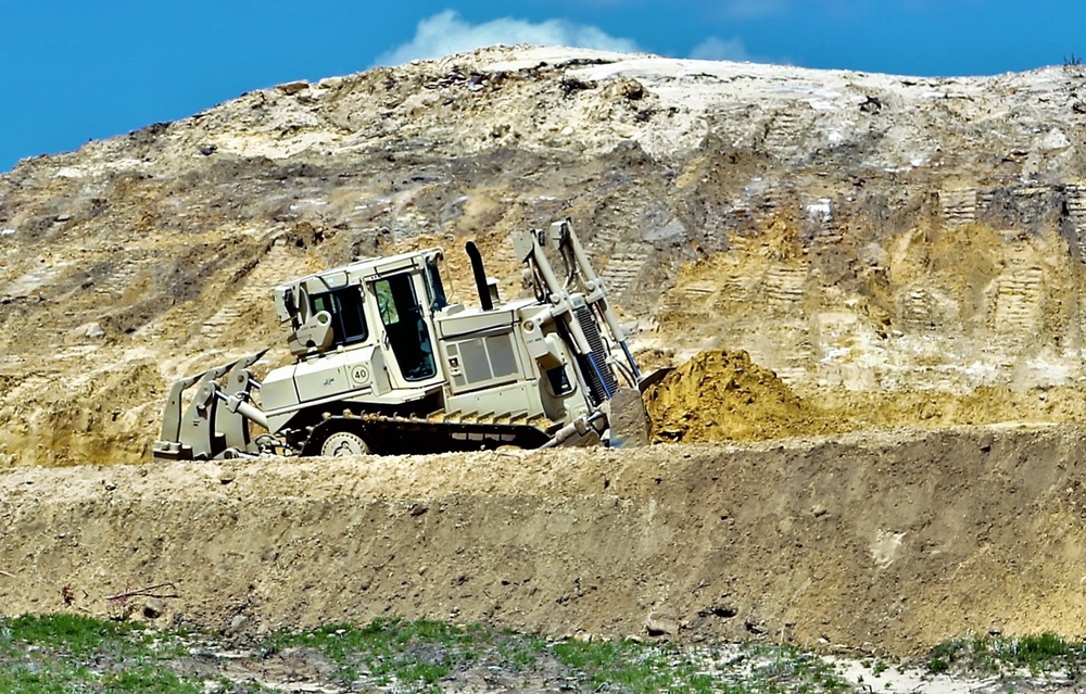 Army Reserve engineer company Soldiers continue work on earth-moving troop project at Fort McCoy