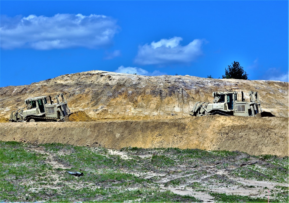 Army Reserve engineer company Soldiers continue work on earth-moving troop project at Fort McCoy