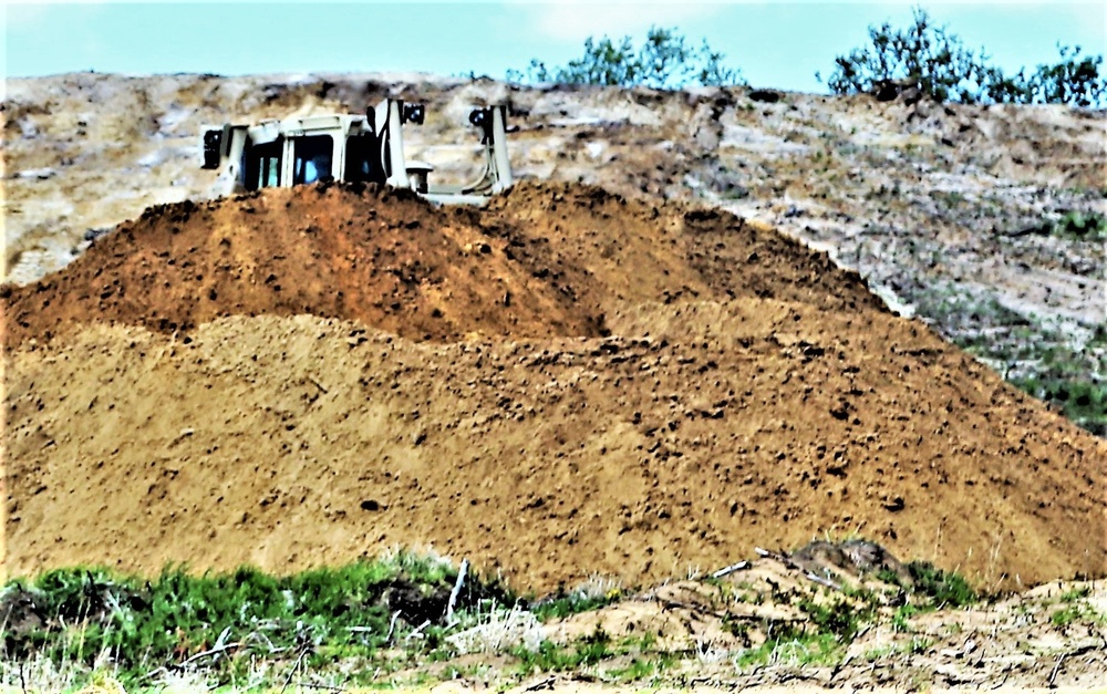 Army Reserve engineer company Soldiers continue work on earth-moving troop project at Fort McCoy