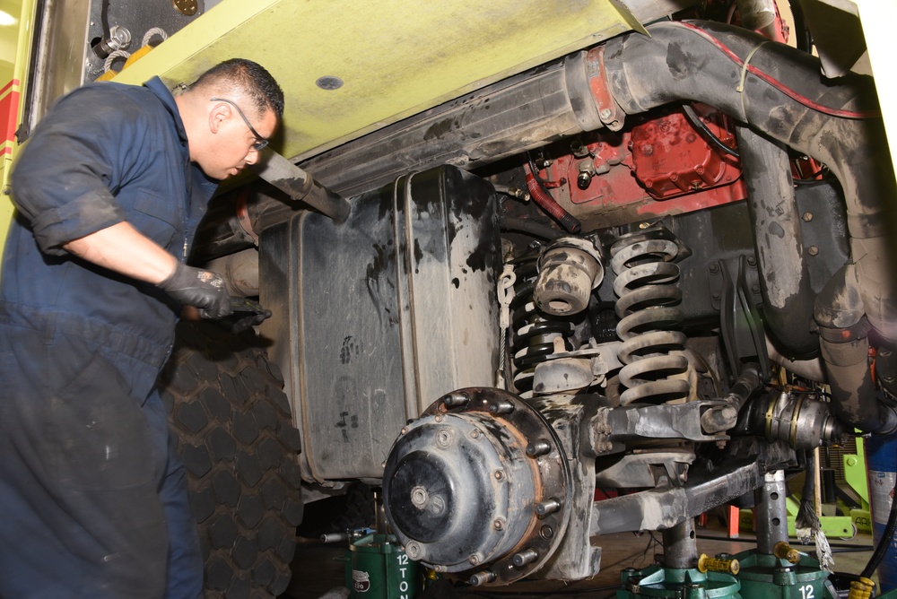 Technical Sgt. Crisanto Vargas helps remove engine