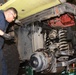 Technical Sgt. Crisanto Vargas helps remove engine