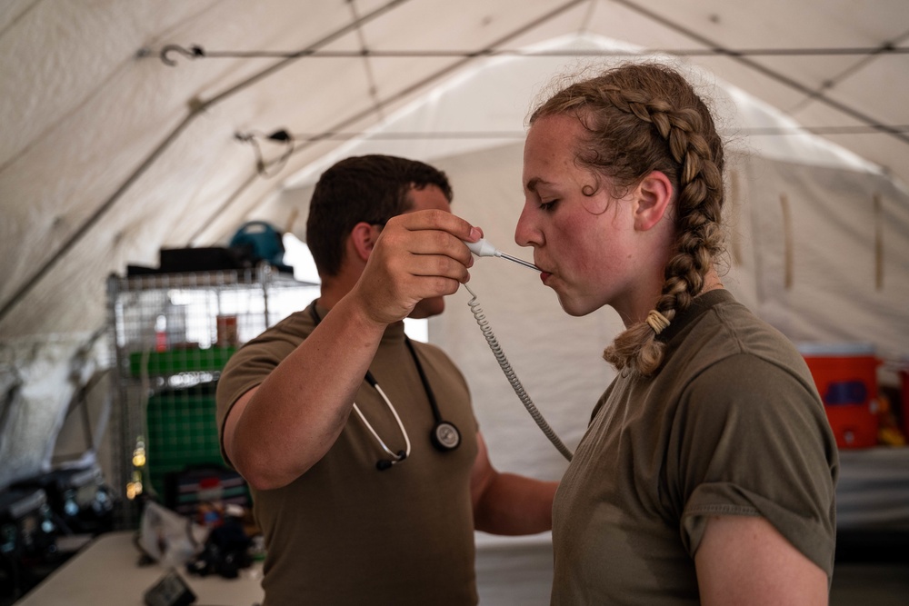 Airmen and Soldiers suit up for a decontamination exercise