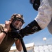 Airmen and Soldiers suit up for a decontamination exercise