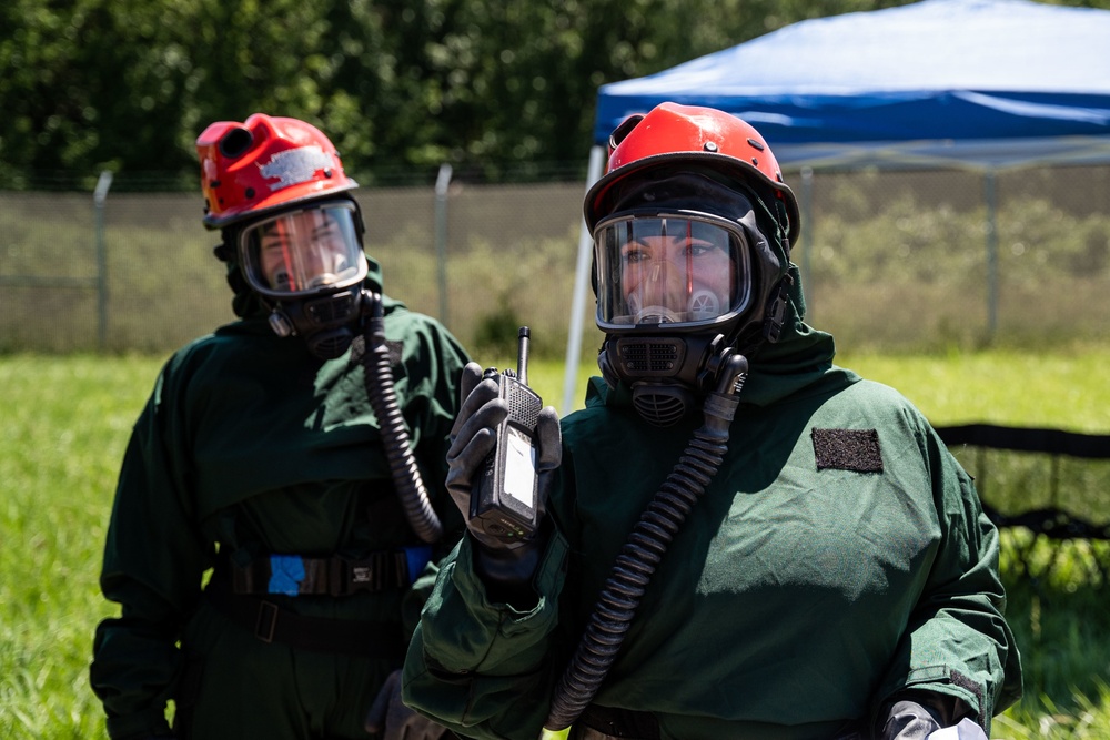 Airmen and Soldiers suit up for a decontamination exercise