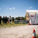 Airmen and Soldiers suit up for a decontamination exercise