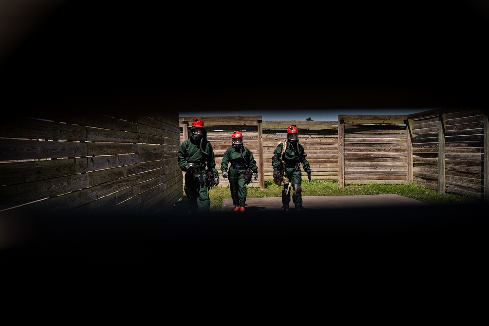 Airmen and Soldiers suit up for a decontamination exercise