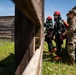 Airmen and Soldiers suit up for a decontamination exercise