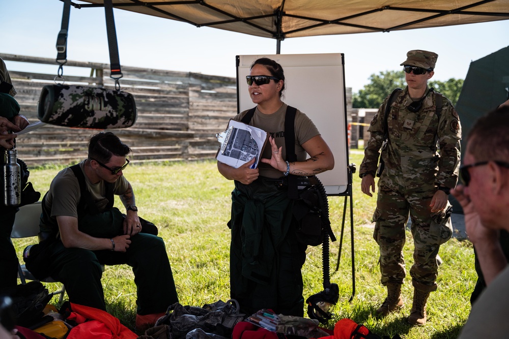 Airmen and Soldiers suit up for a decontamination exercise