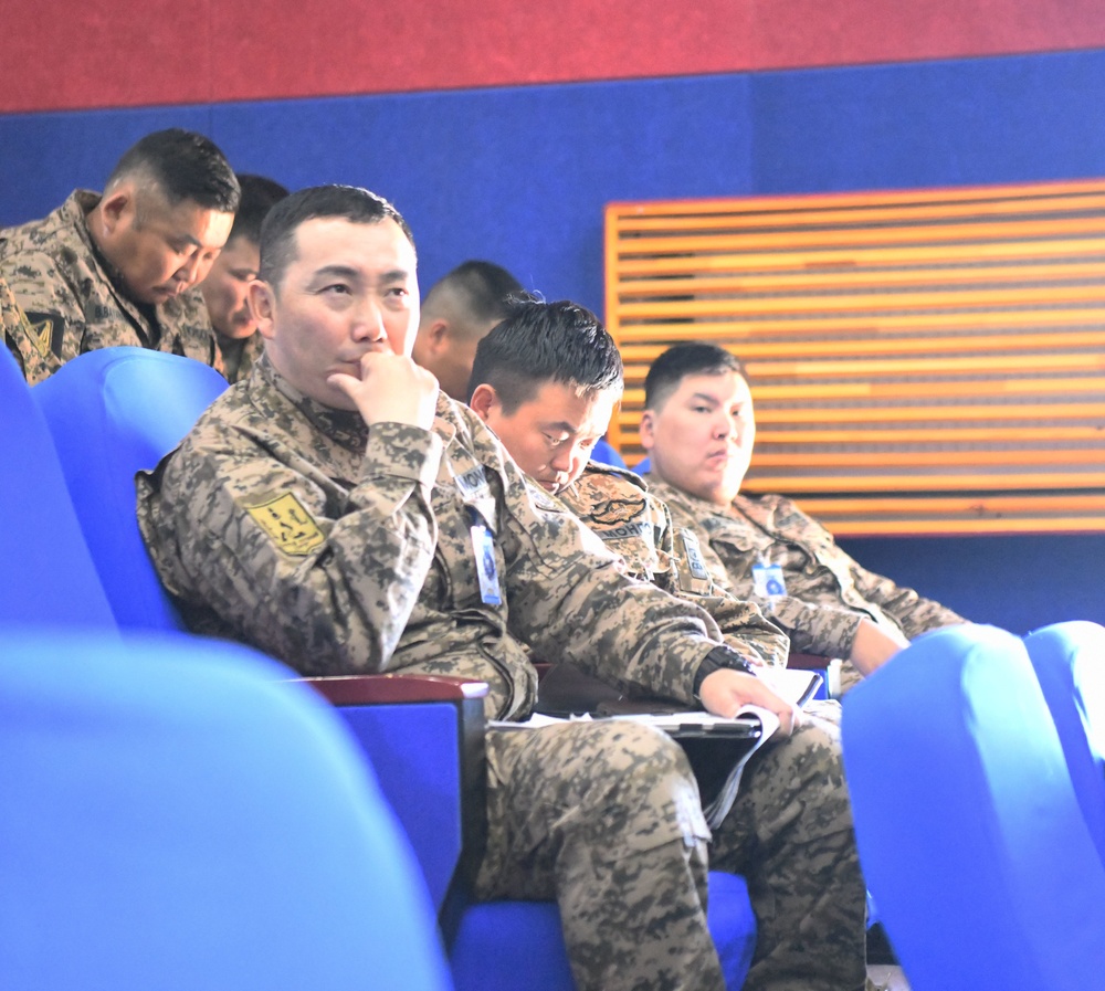 Khaan Quest Participants Listen To Negotiations in Peacekeeping Operations Brief
