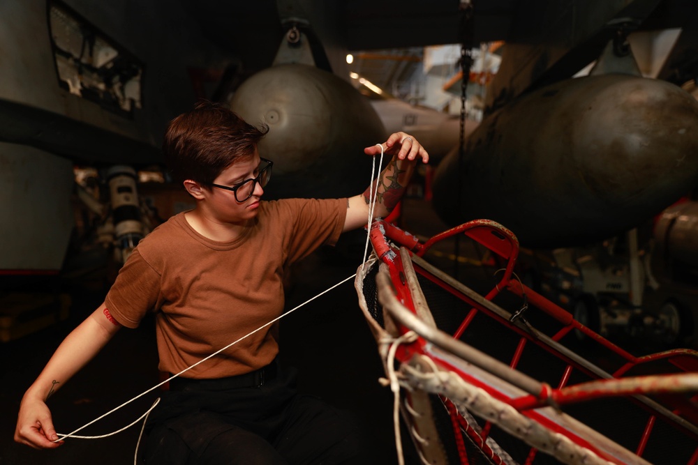 Abraham Lincoln Sailor conducts maintenance