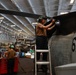 Abraham Lincoln Sailor conducts aircraft maintenance