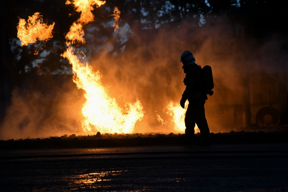 Latvian, Michigan Air National Guard firefighters perform night burn