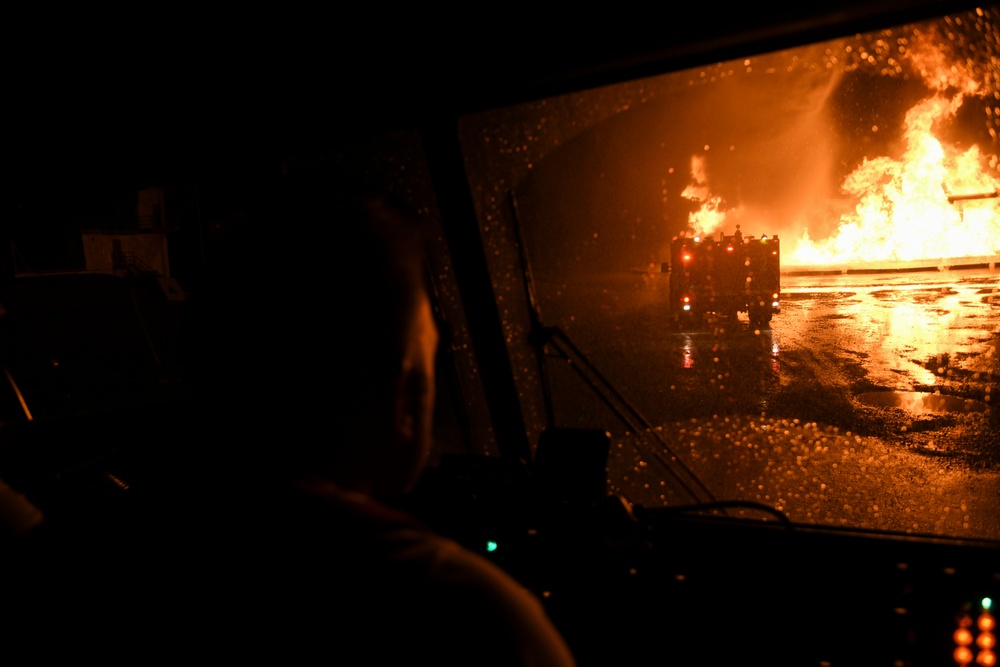 Latvian, Michigan Air National Guard firefighters perform night burn