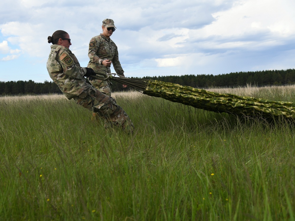Aerial Port Airmen catch C-130 airdrop during Agile Rage 22